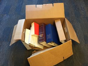 Incorrect packaging of documents- box open, not labeled, and broken